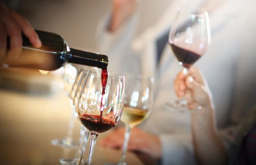 Red wine being poured into a glass